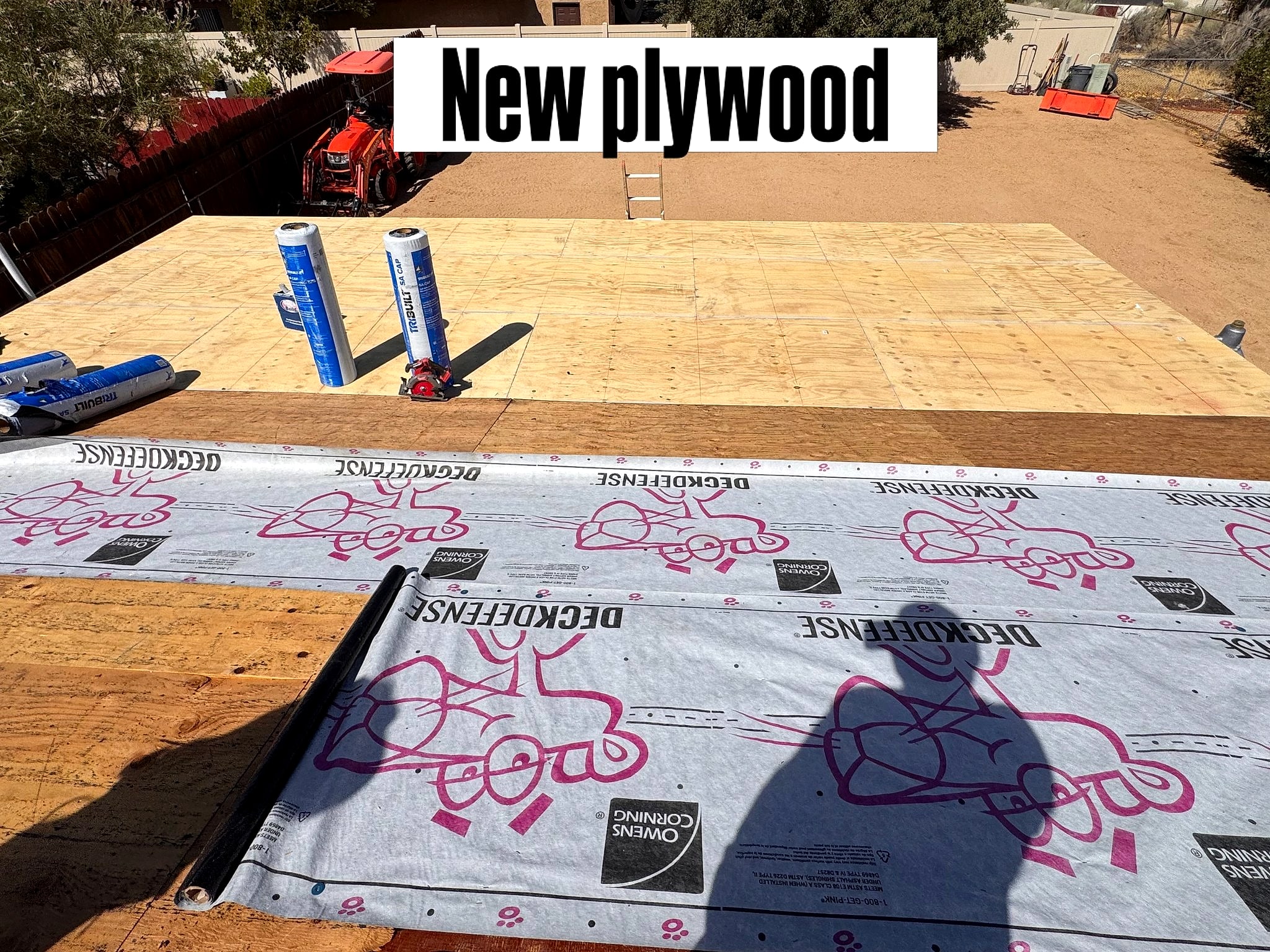 New plywood roof deck with Owens Corning Deck Defense underlayment rolled out