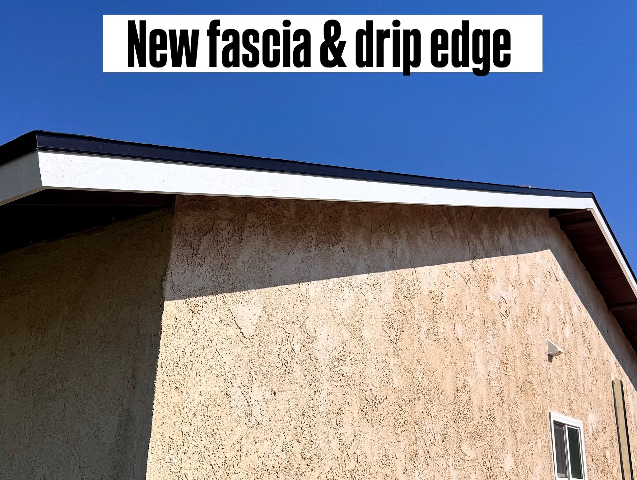 New white fascia with metal drip edge along the eave