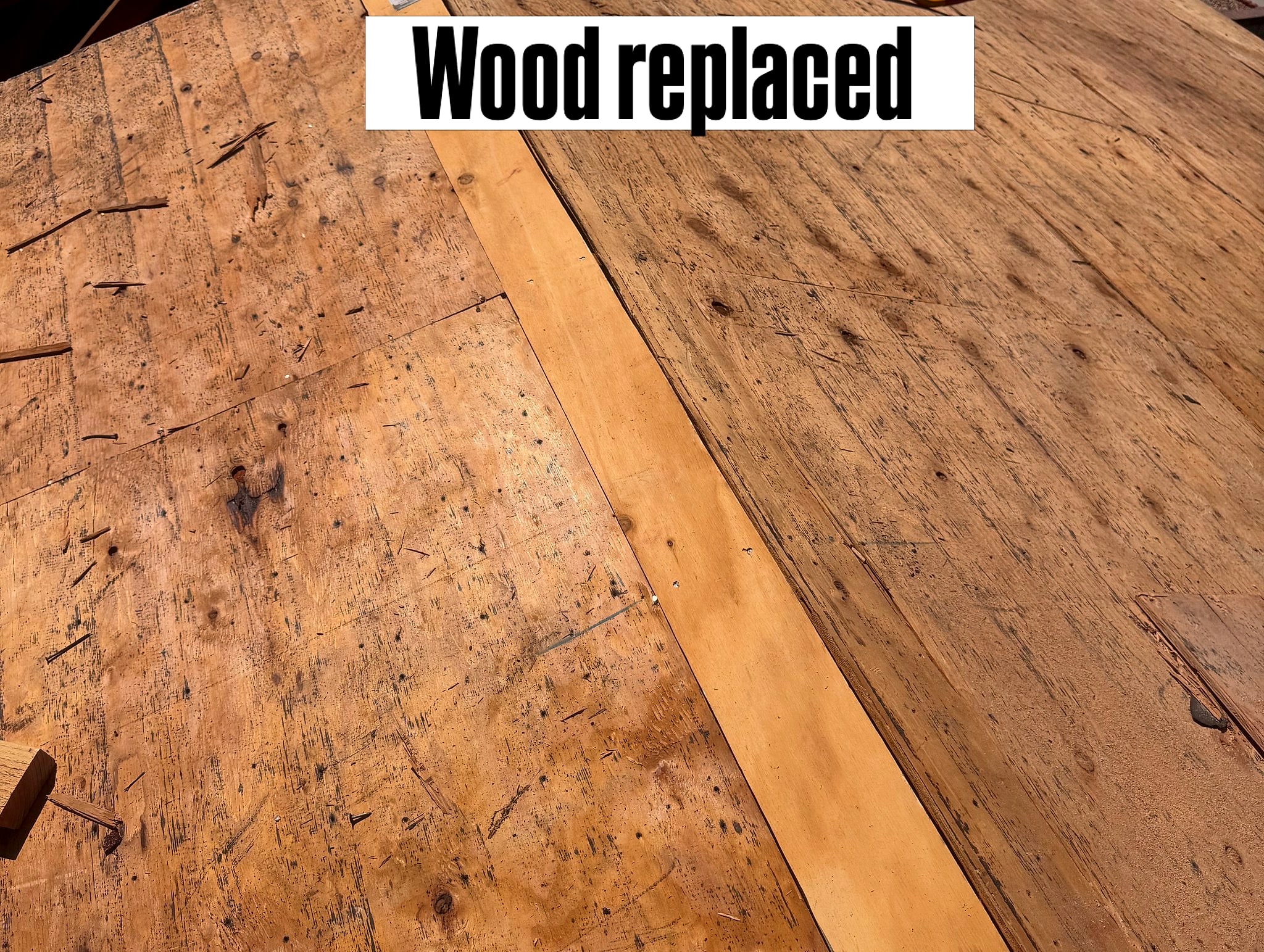 A new board patched into the old roof decking